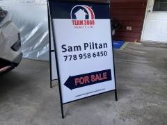 Metal real estate sign